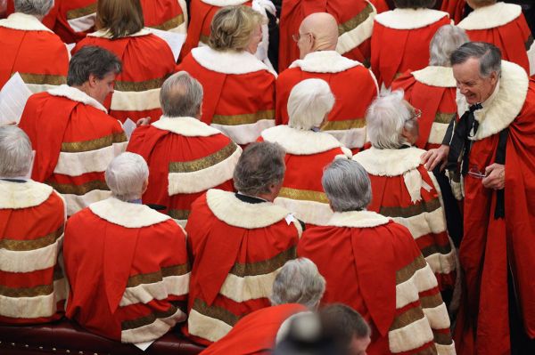 Peers wait in in the House of Lords for the arrival of Queen Elizabeth II, and Prince Philip, the Duke of Edinburgh, to conduct the State Opening of Parliament